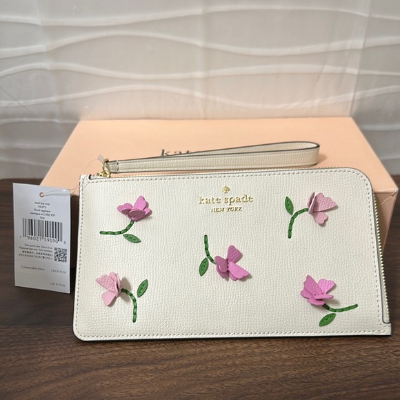 kate spade Handbags - Kate Spade Cream Wristlet with Pink Floral Accents